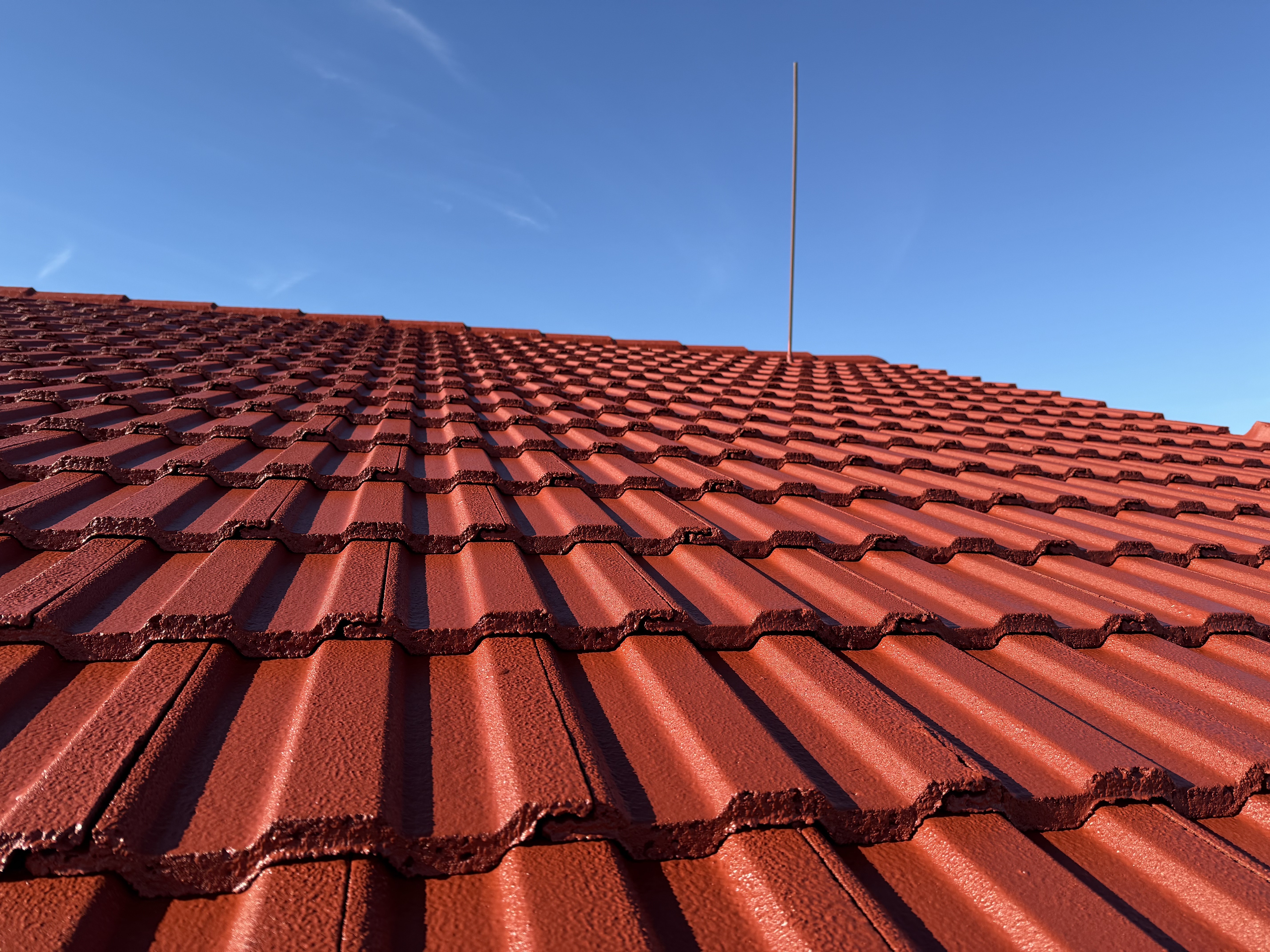 Concrete Tile Roof restored and painted by the team at Northland Roof Coatings.